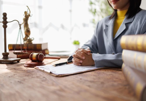 Criminal defense attorney preparing legal documents at a desk