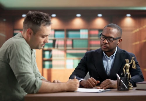 DUI defense attorney reviewing legal documents with a client