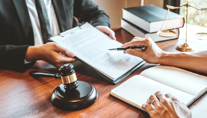 DUI defense attorney reviewing legal documents with a client